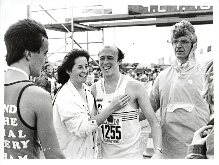 1985 - DJ Mike Holloway at the finish line after raising £2,500 for Aberdeen maternity Hospital's Special Nursery appeal.