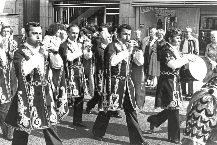 A group of musicians playing their instruments in a parade