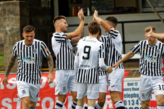 Brian Cameron, second from left, struck twice at Annan. Image; Bob Crombie.