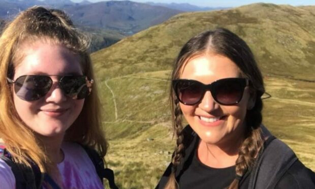 Left to right: Caitlin Goss on top of Ben Nevis with children's home staff member Elaine Glen. Supplied by Who Cares? Scotland.