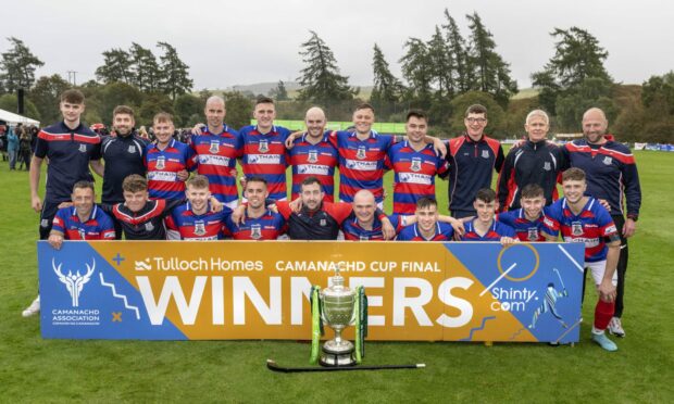 The victorious Kingussie team after beating Lovat in the Camanachd Cup final.