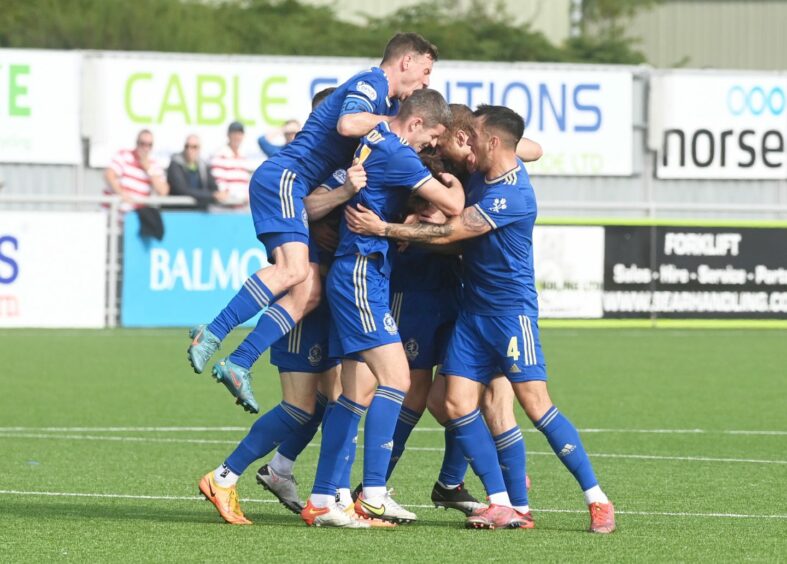 Cove Rangers players celebrate Jamie Masson's goal. Photos by Chris Sumner