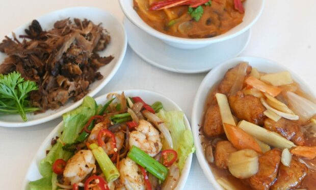 A selection of the dishes. Featured from left top to to top right are a quarter crispy aromatic duck, salt and pepper prawns, honey chilli chicken, beef panang. Pictures by Chris Sumner.