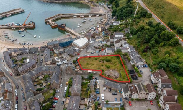 The shaded area is a half-acre development site near Stonehaven harbour on the market.