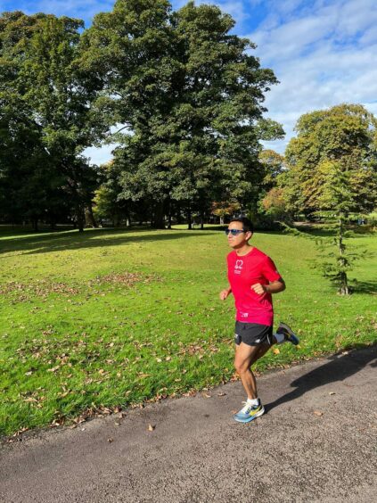 Dr Victor Velecela running in park as he trains for London marathon to raise funds for his own research into heart disease 