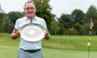 Iain Galbraith of Murcar Links Golf Club with the senior gents' scratch trophy he won in 2022. Image: Jasperimage