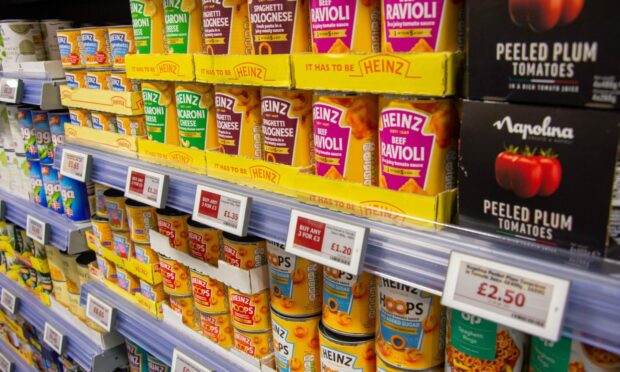 Scotmid's boss says the retailer is trying to avoid passing on fast-rising costs - but for how long can it avoid doing so?