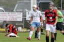 Ross Gordon celebrates the opening goal for Skye against  Glenurquhart.