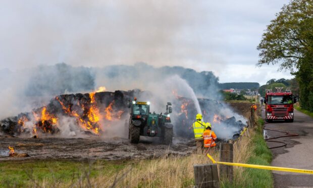 The fire service and Gordonstoun School fire unit this morning. 
Gordonstoun are in orange vests. Photo by Jasperimage.