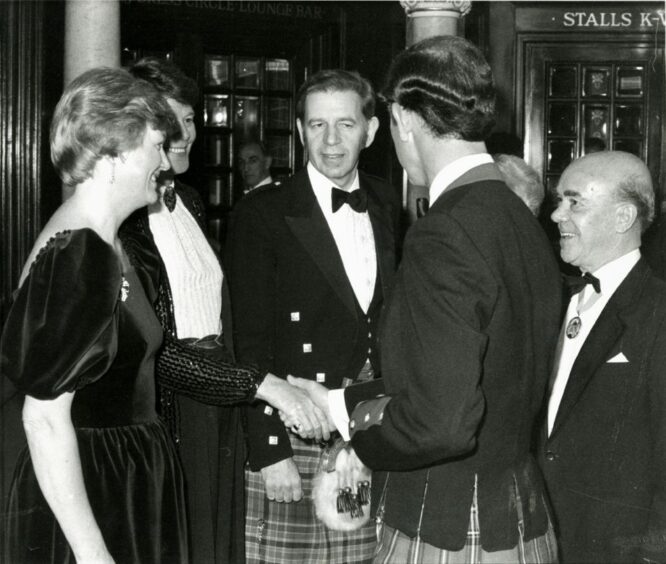 The Prince of Wales shaking hands at a Royal Gala in September
