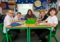 Head teacher Amanda Blackwood joins Skene School pupils Cameron, Daniel, Alex and Alex as they design their Aberdeenshire flags. Picture by Kath Flannery