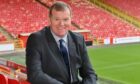 Rob Wicks as Aberdeen FC commercial director sitting in Pittodrie