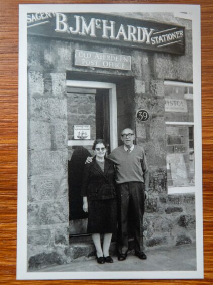 Original owners, Frank and Bessie McHardy, proudly stand in front of the shop