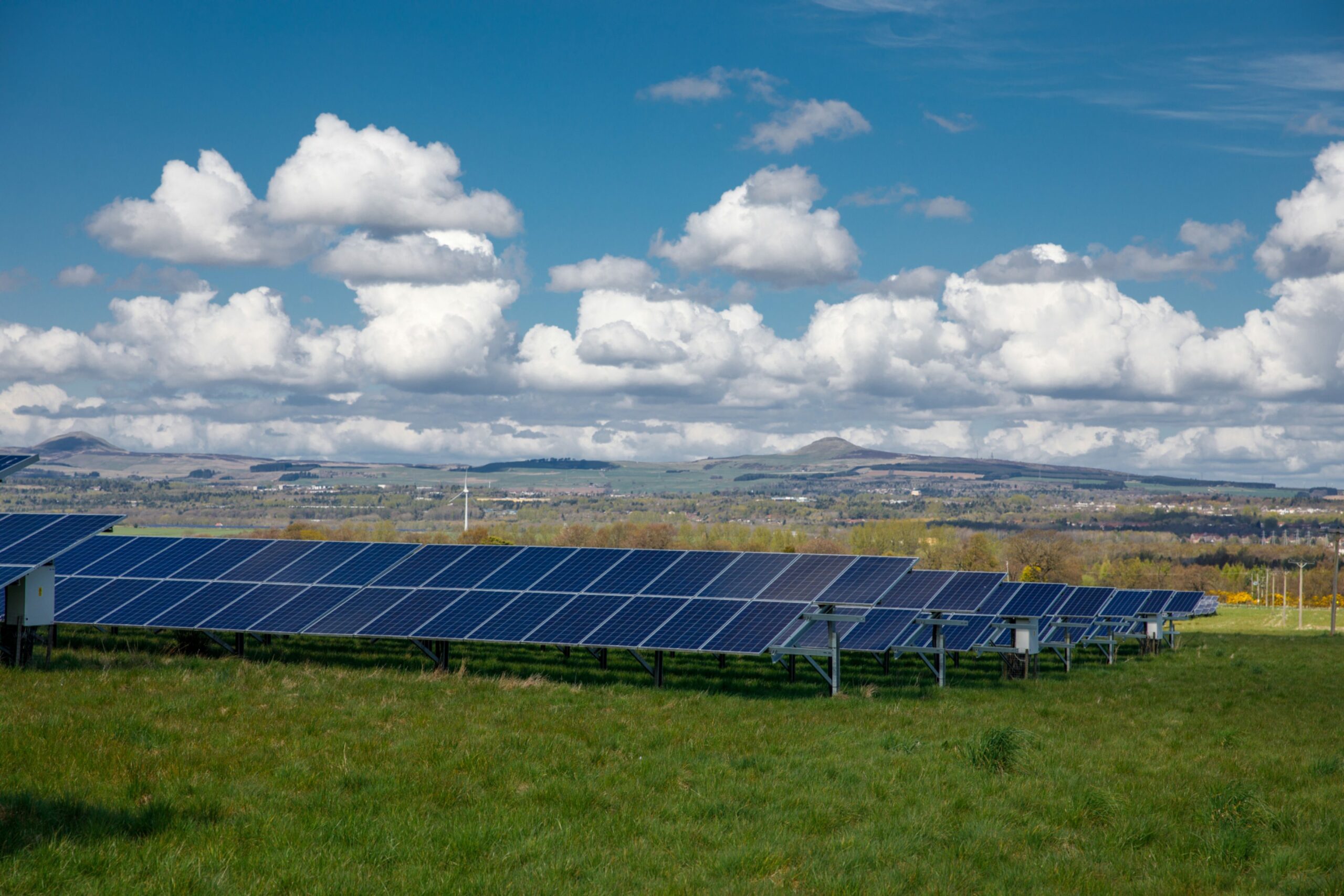 Black solar panels in a field