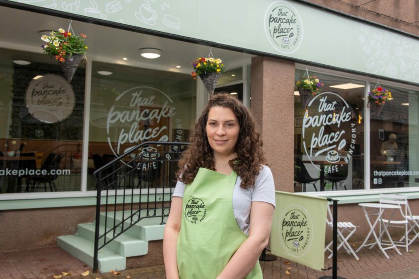 Charlotte standing outside That Pancake Place