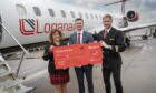 l-r Cabin crew member Beverley Law, chief commercial officer Luke Lovegrove and first officer Jordan Cameron celebrate the restart of Loganair's flights between Aberdeen and Oslo.