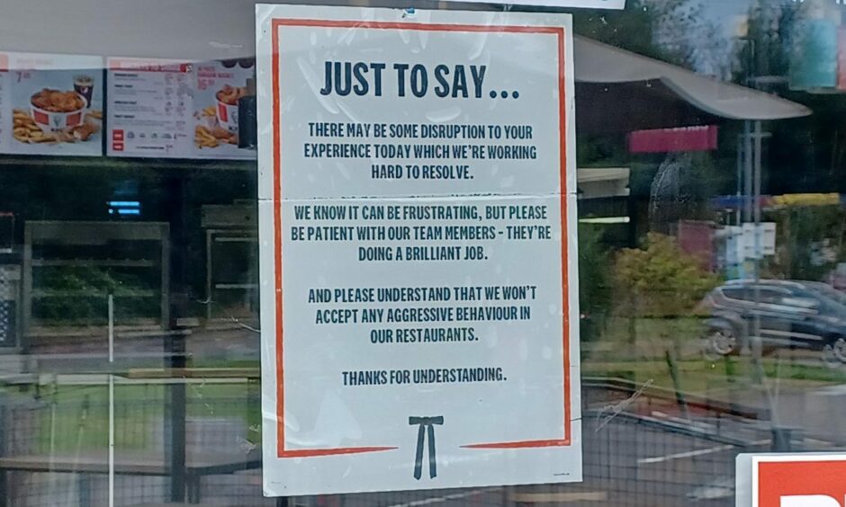 KFC notice on door about closures and staff shortages