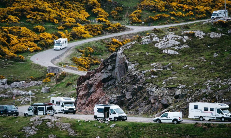 Campervans on the road near Durness.