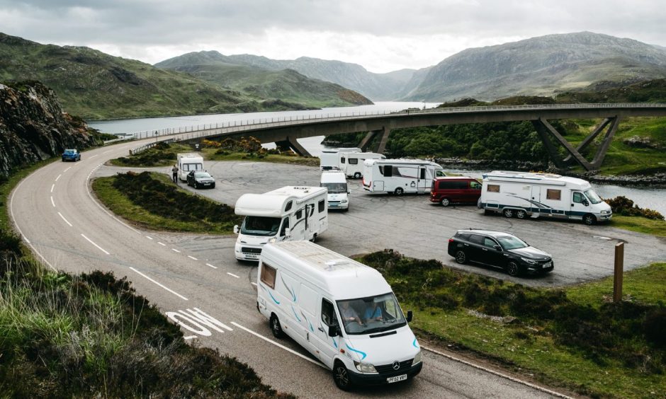 Campervans on busy road