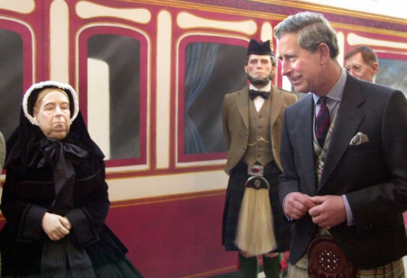 Prince Charles "meeting" a life-size model of Queen Victoria in Ballater in 2015 at an exhibition about the Royal Deeside Railway.