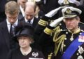 King Charles, alongside his family, salutes during the funeral of his grandmother in 2002. Picture by PA