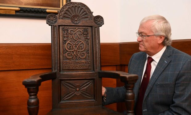 One of the rare chairs in the collection of The Seven Incorporated Trades of Aberdeen, with ex-deacon convener David Parkinson.