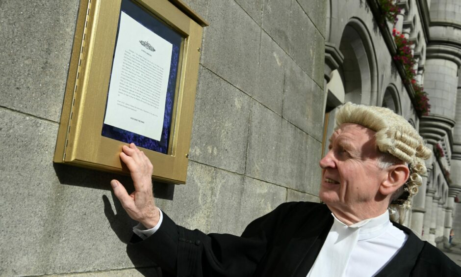 Sheriff Philip Mann read the proclamation of King Charles III in Aberdeen's Castlegate. It was less than an hour after the Queen's cortege had passed through the city. Picture by Paul Glendell/DCT Media.