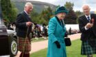 Former president David Geddes, pictured with the Queen and King Charles, at the Braemar Gathering in 2018, said the monarch  relished in the games each year whist enjoying the days festivities. Picture by Kenny Elrick.