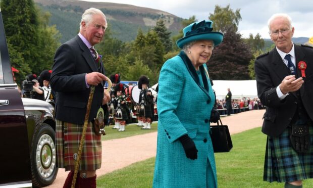 Former president David Geddes, pictured with the Queen and King Charles, at the Braemar Gathering in 2018, said the monarch  relished in the games each year whist enjoying the days festivities. Picture by Kenny Elrick.