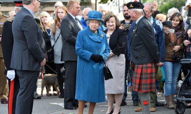 The Queen on a visit to Ballater to meet Storm Frank victims in 2016.
