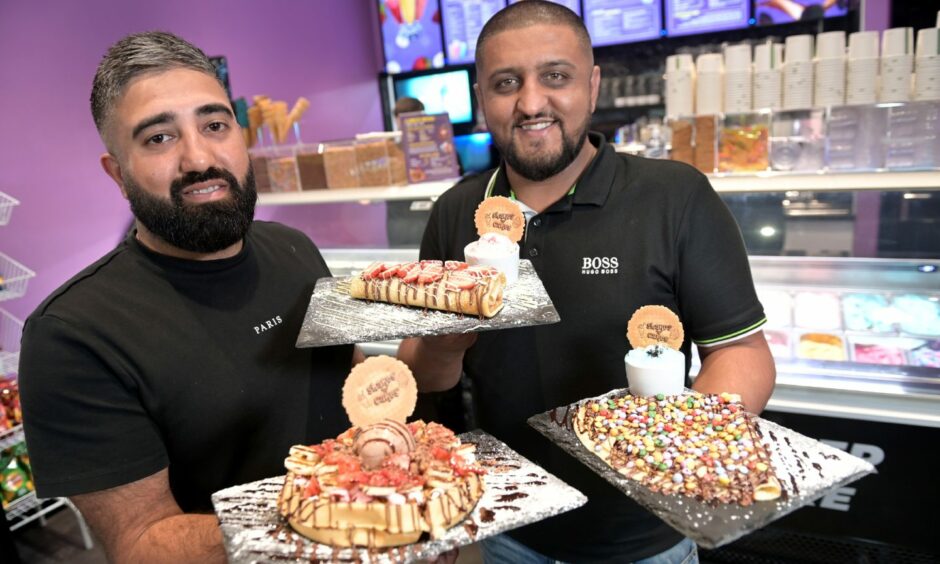 Co-owners Haroon Ahmed and Bobby Malik show off desserts at Shakes 'n' Cakes in Aberdeen.