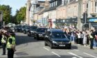 People clapped as the cortege drove through Banchory. Photo: Sandy McCook/DC Thomson