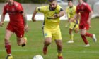 Adrew Macaskill in action for Buckie Thistle in their Scottish Cup win against Lossiemouth. Picture by Sandy McCook