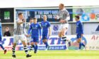 Russell Dingwall celebrates after curling home Elgin City's opener against Peterhead.