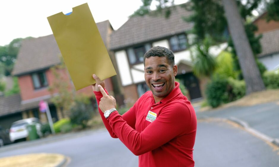 Postcode Lottery employee going to give prize to lucky winners