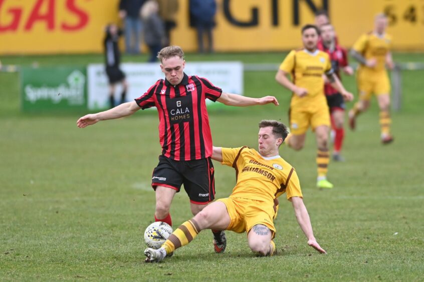 Inverurie Locos player being tackled.