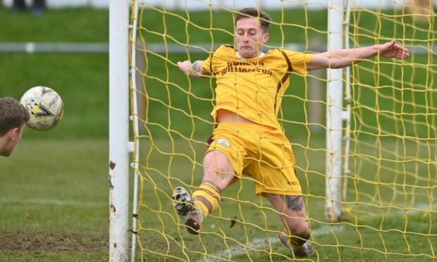 Forres Mechanics defender Dale Wood clears the ball off the line against Inverurie Locos. Picture by Scott Baxter 05/03/2022