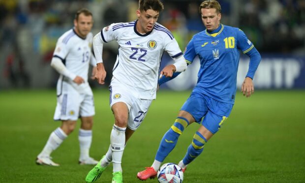Scotland's Aaron Hickey (left) and Ukraine's Mykhailo Mudryk battle for the ball during the UEFA Nations League match at the Stadion Cracovii in Krakow, Poland.