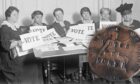 Black and white image of women sitting at a table with posters that say 'VOTE' next to the coin that Smile Scotland have restored