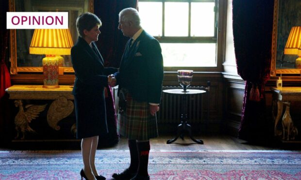 First Minister Nicola Sturgeon and King Charles III shake hands at the Palace of Holyroodhouse (Photo: Peter Byrne/AP/Shutterstock)