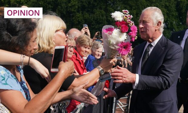 King Charles III is greeted by well-wishers during a walkabout to view tributes left outside Buckingham Palace (Photo: Yui Mok/PA Wire)