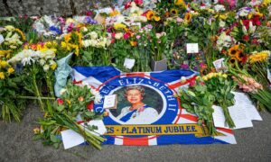 A Jubilee flag laid out among the floral tributes
Picture by Wullie Marr / DC Thomson