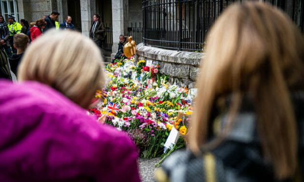 Flowers have been left at the gates of Balmoral. Picture by Wullie Marr/DC Thomson.