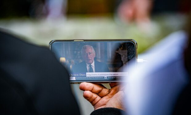 King Charles III has given his first address to the nation, watched on phones by those at Balmoral. Picture by Wullie Marr/DC Thomson.