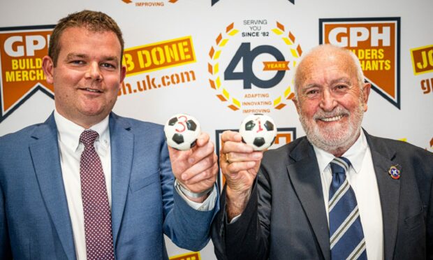 GPH Builders Merchants managing director Grant Shewan, left, and Breedon Highland League president George Manson, right, at the Highland League Cup draw. Pic by Wullie Marr