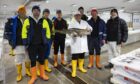 Scottish Seafood Association CEO Jimmy Buchan, holding the fish, with some of the other processors who are backing the bid for a green freeport in the north-east.