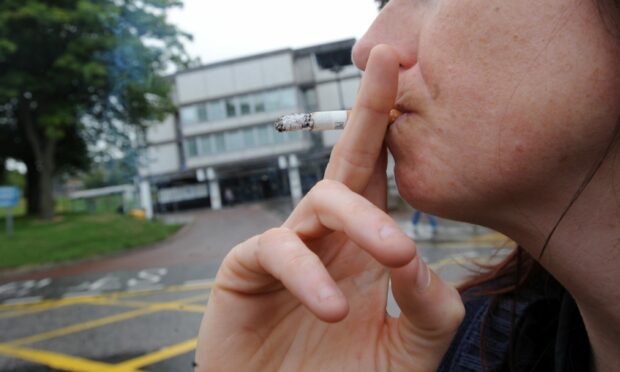 A new law is banning smokers from lighting up when they're near hospital buildings. Picture by Simon Walton.
