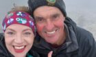 Courtney Ferguson and Trevor Botwood at the Ben Nevis summit. Supplied by Courtney Ferguson/NHS Lothian/PA