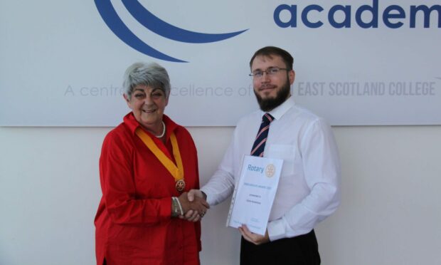Gytis Kontrimas of Nescol Fraserburgh presented with Rotary Endeavour Award by Ann Bell.