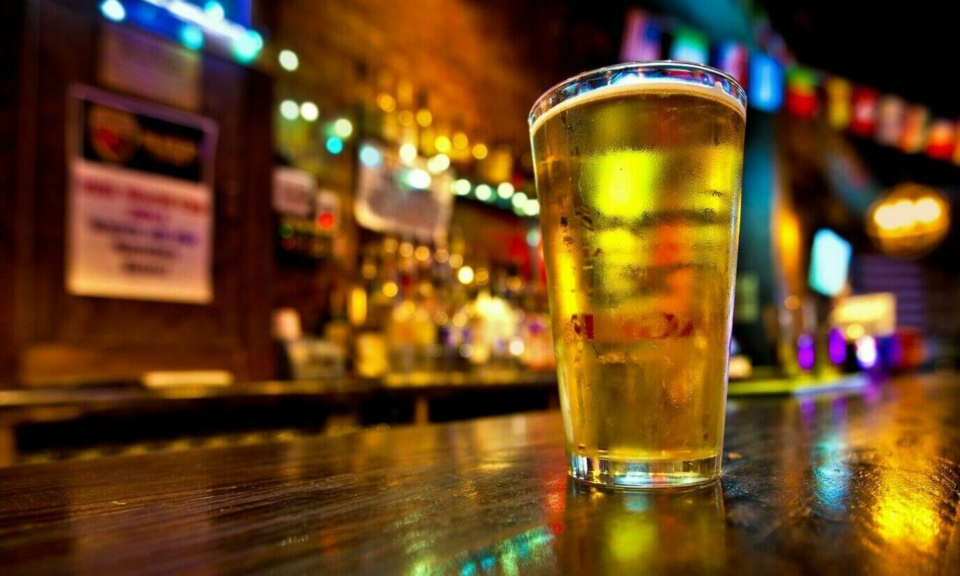 Pint of beer on a bar.